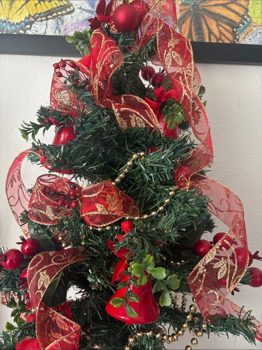 Decorative Holiday Tree with Red Ribbon and Bells